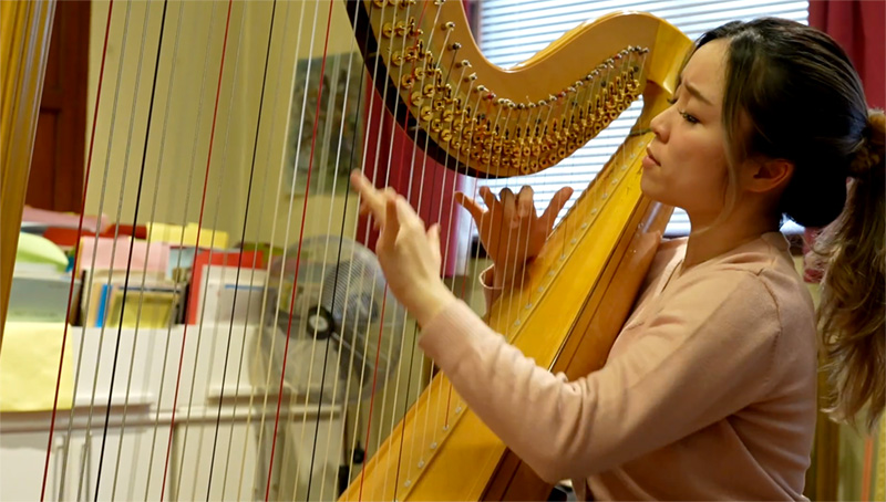 Katie Lo playing the harp at The Royal Academy of Music